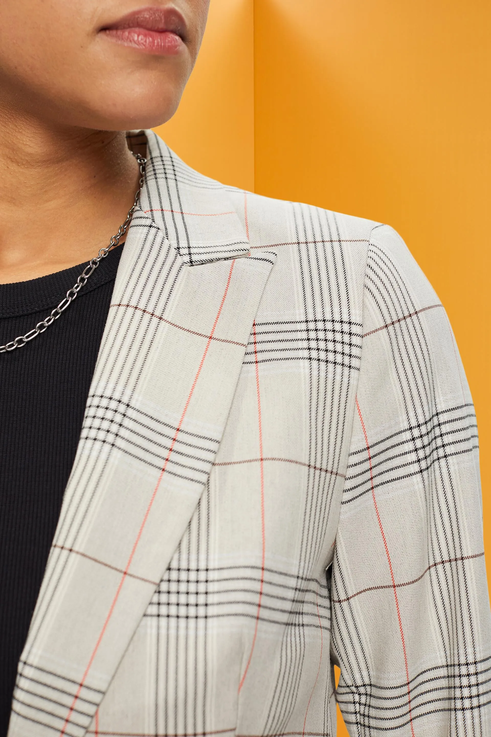 Blazer à carreaux et un bouton
