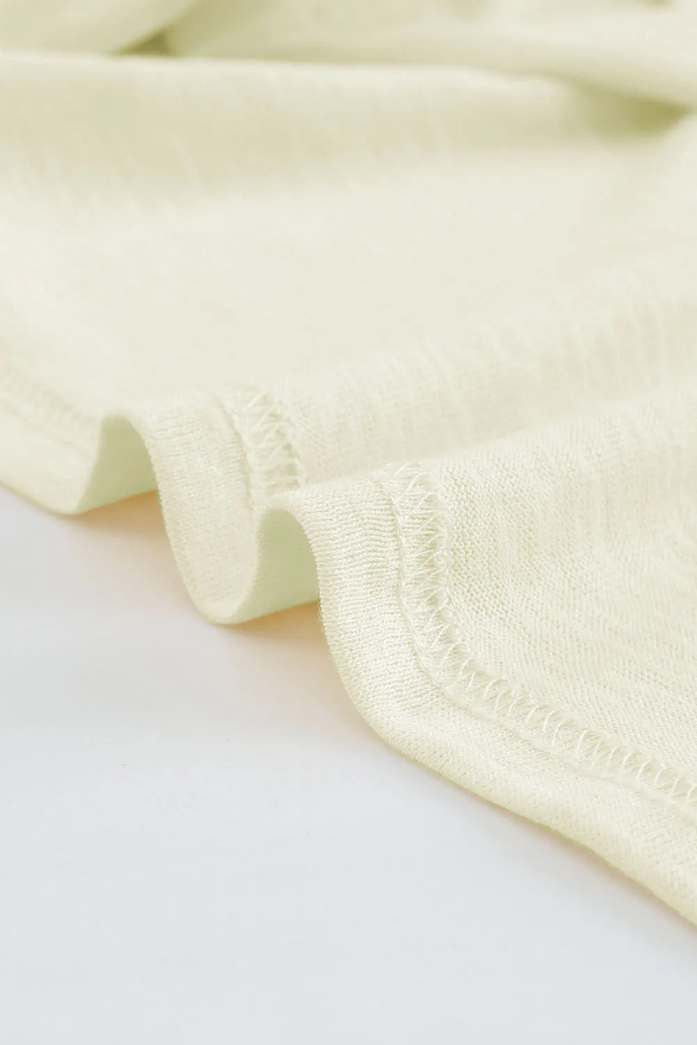 Cardigan beige à boutons ouverts de couleur unie