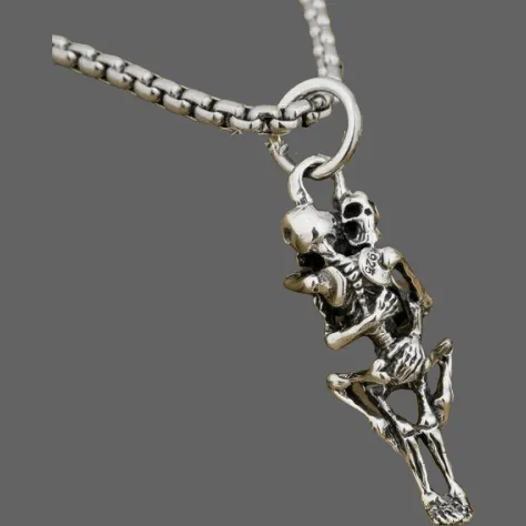 Pendentif squelette faisant l'amour