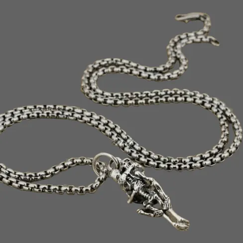 Pendentif squelette faisant l'amour