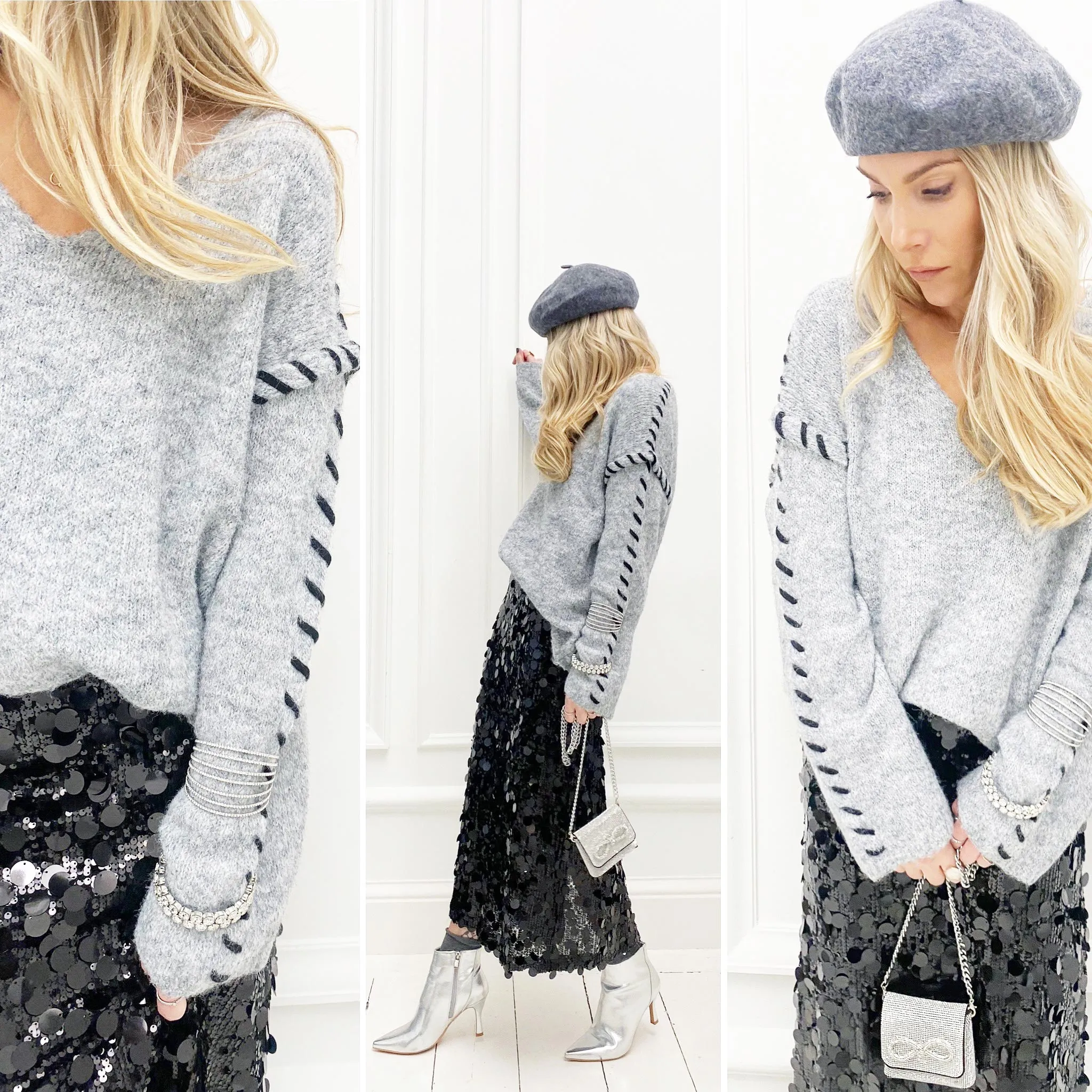 Pull gris surpiqûres noires col v