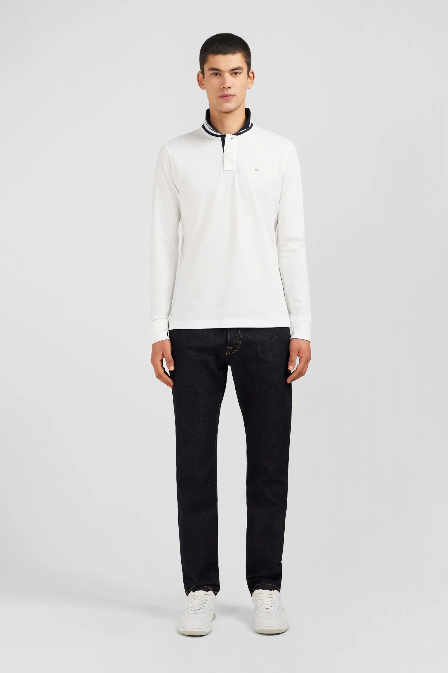 White cotton long-sleeved polo with contrasting collar.